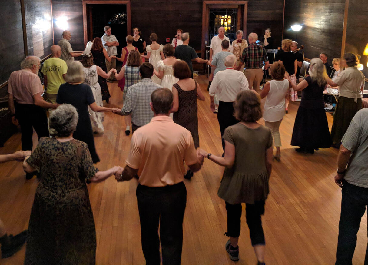 Photograph of a Jane Austen action figurine with bendable arms, a quill pen and a writing desk Photograph of a Jane Austen action figurine with bendable arms, a quill pen and a writing desk